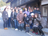 Group photograph in front of a shop of ink stones