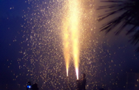 Two men holding tezutsu fireworks at the Toyohashi Gion Festival