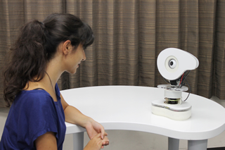 A user interacting with the Talking-Ally robot