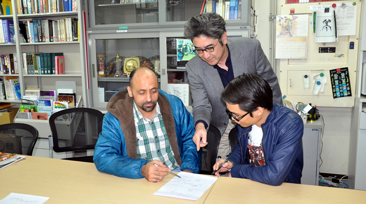 From left: Gamal ElMasry, Shigeki Nakauchi, and a student