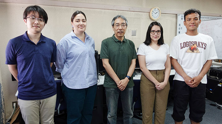 Professor Jun Miura (center) and his lab members.