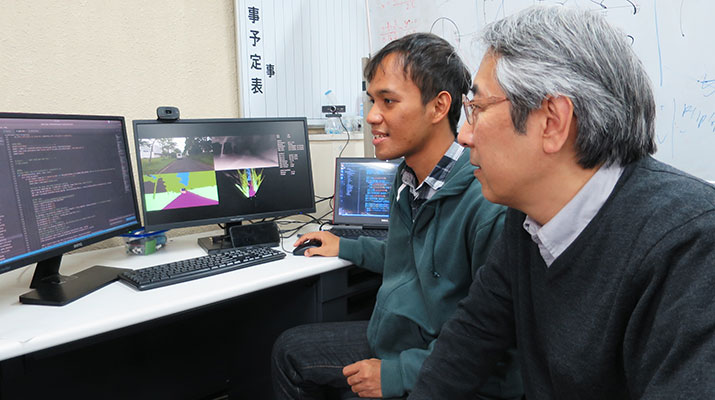Prof. Jun Miura (Right) and Oskar Natan (Left)