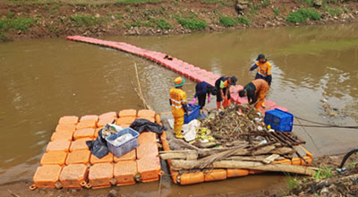 Garbage collection from surface water of rivers in Jakarta.